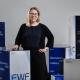 Isabella Fritz behind a podium that says FWF