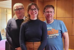 from left to right, Louise Mycock, Frances Dowle, and David Willis iin a relaxed pose in a wood panelled room