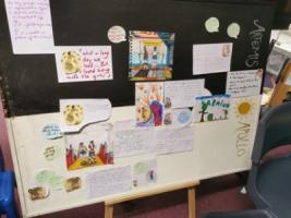 A display board that is half black and half white. The black top half is title Artemis and the white bottom half is titled Apollo