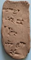 A clay tablet with some cuneiform marks
