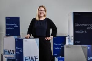 Isabella Fritz behind a podium that says FWF